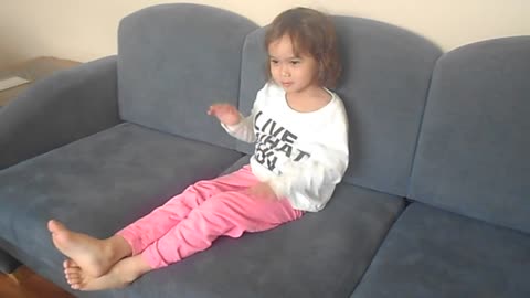 Girl has a funny way of sitting and watching tv