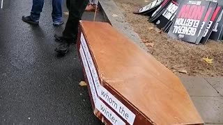 Man with coffin for the disabled and poor!