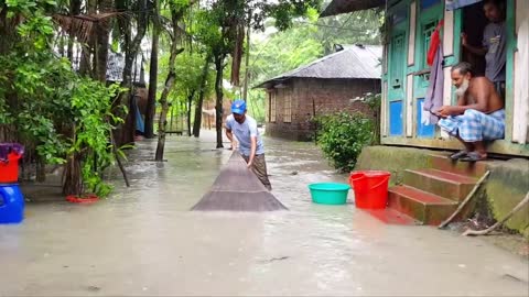 Village fishing in front his house