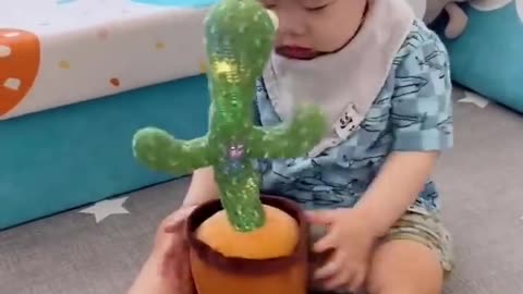 Babies play dancing cactus toy. Cutest baby funniest