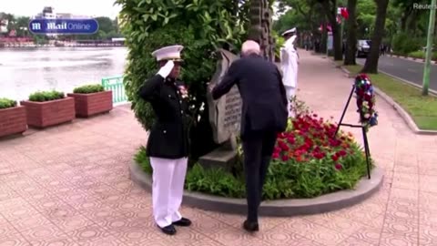 Why is Joe Biden kissing John McCain’s memorial in Vietnam?