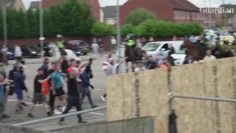 Asylum seekers film rioters making threatening gestures as they surround Rotherham hotel