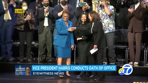Kamala Harris laughs after she swears in the new mayor of Los Angeles