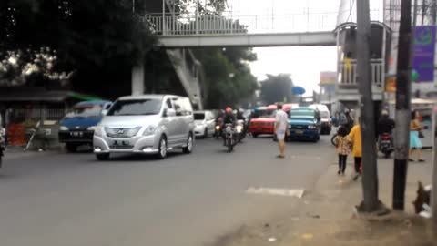 Crossing a busy street in Jakarta