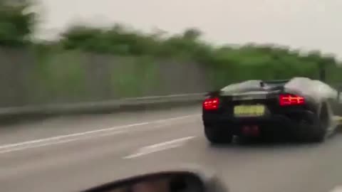 The powerful sports car with its tail breathing fire is too powerful