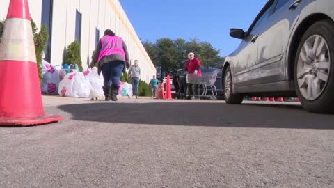 Families receive donated toys from the Magical Toy Drive