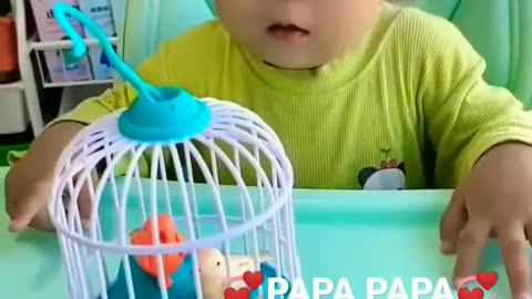 Toddler learning to call daddy