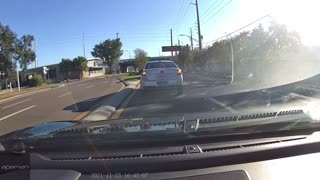Distracted Driver Nearly Crashes