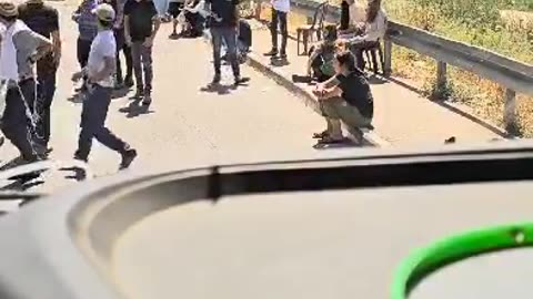 Israeli settlers block road