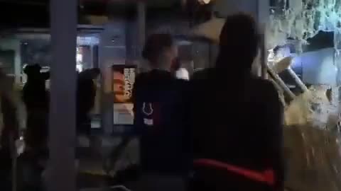 Protesters vandalize a McDonald's restaurant due to the Israel-Palestine conflict