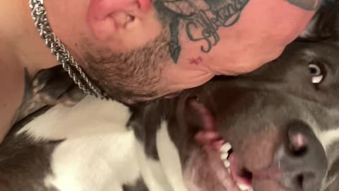 Dog Makes Funny Noises While Getting Kisses From Dad