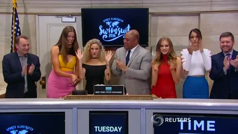 Sports Illustrated models ring the closing bell