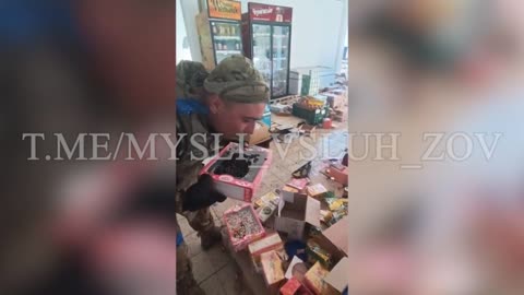 Another piggy from the Ukrainian army is doing what they do best Looting shops spoiling foods..