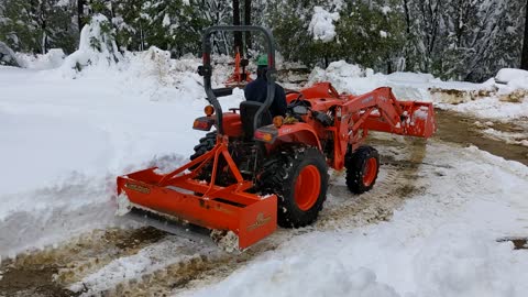 Removing snow from the driveway with our Kubota tractor part #3