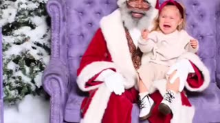 Kid is traumatized by black Santa!😁😂