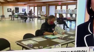 Poll worker marking ballots in plain sight