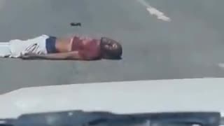 Guy Falls Off The Roof Of Moving Car - Don't do this.