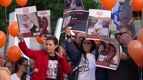 Relatives of infant hostage call for his release during protest in Tel Aviv