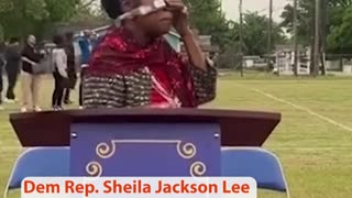 Shelia Jackson putting on her eclipse glasses.