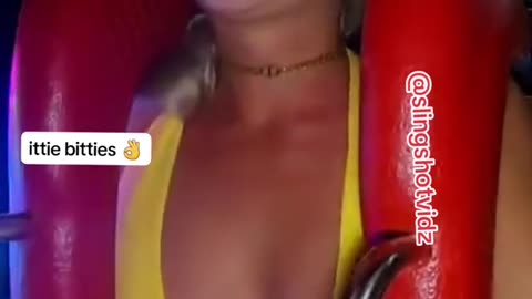 hot chick rides the sling shot ride