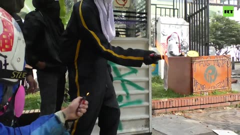 Hooded protesters confronted police at the campus of the Pedagogical University