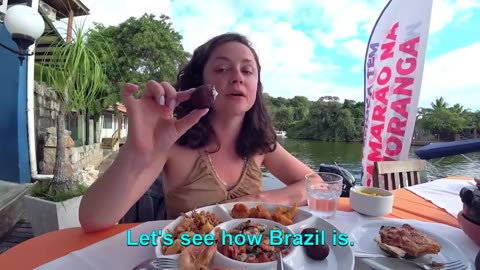 A Russian woman expressing seafood for the first time in Brazil.