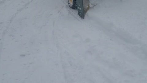 9 year old handles snowblower