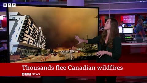 Canada wildfires: Winds push fires away fromoil hub after residents flee homes | BBC News