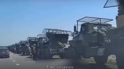 A column of Russian fighters with BM-21 Grad MLRS holding a course to the front line.