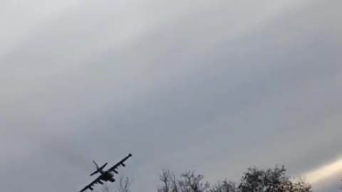 Two Russian SU-25's flying at low levels