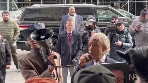 Al Sharpton leads a protest outside the office of Bill Ackman