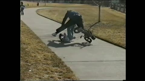 Kid Learning To Ride A Bike Wrecks And Takes Out Dad