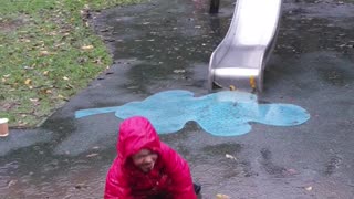 Kid Laughs off a Face Full of Mud after Fun Trip Down the Slide