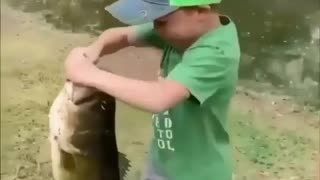 Little Kid Catches A Huge Fish