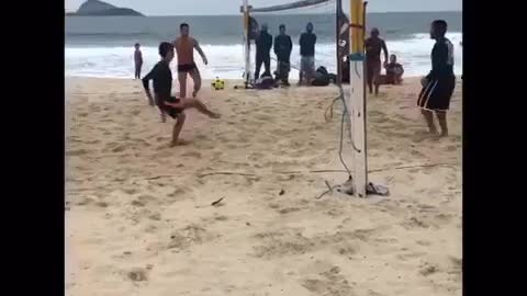 Beach volleyball with upside down golden hook