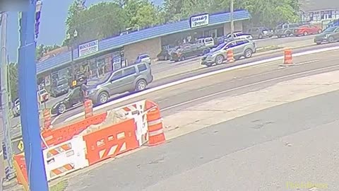 Surveillance video shows a man shooting at his brother in a car before he was shot by an officer