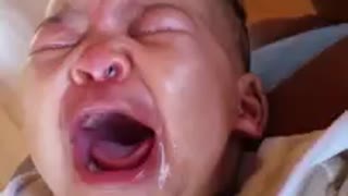 Mom's bad singing makes baby cry