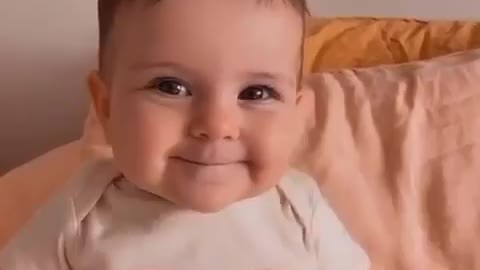 Baby smiling and happy while making video