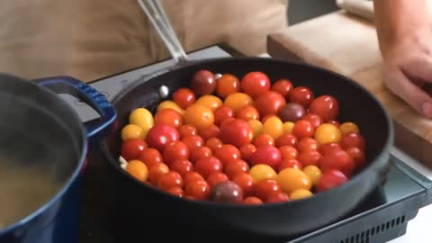 Cut bacon into small pieces and heat olive oil in a pan.