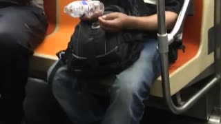 Guy falling asleep spills water on guy sitting next to him
