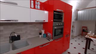 Akaisha in the Kitchen in Renovated Cave Apartment, Matera, Italy