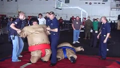 SUMA wrestling my son John aboard the USS Ronald Reagan 76