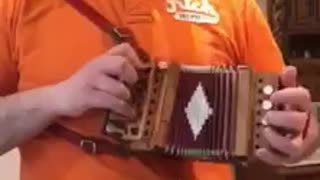 a great concertina player with a small concertia