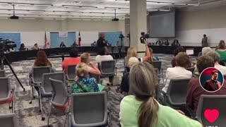 Concerned Citizen reads book during school board meeting.... WTF?!