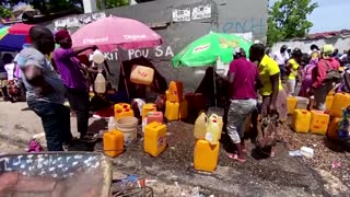 Haitians protest, pay tribute to president