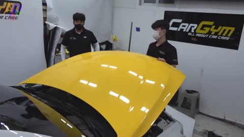 Process Of Turning Old BMW Into New Yellow Car. Korean Car Wrapping Technician