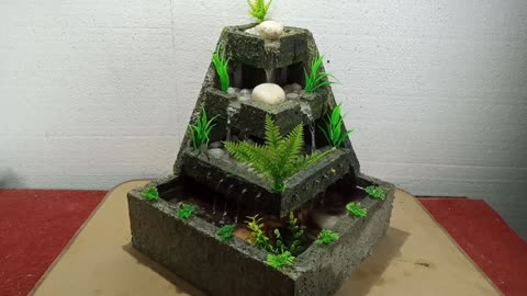 Homemade Styrofoam and cement mini water fountain waterfall