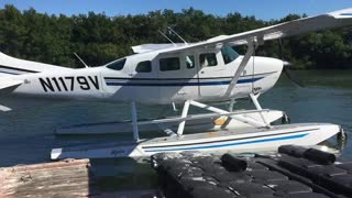 airplane lands on the river