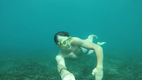 Filming himself under water