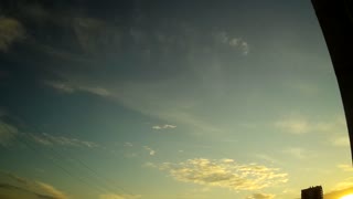 Time-lapse of clouds at sunset